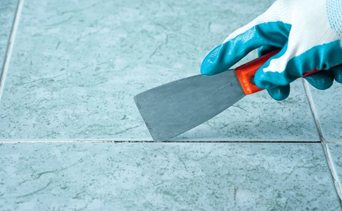 Regrouting or replacing tile